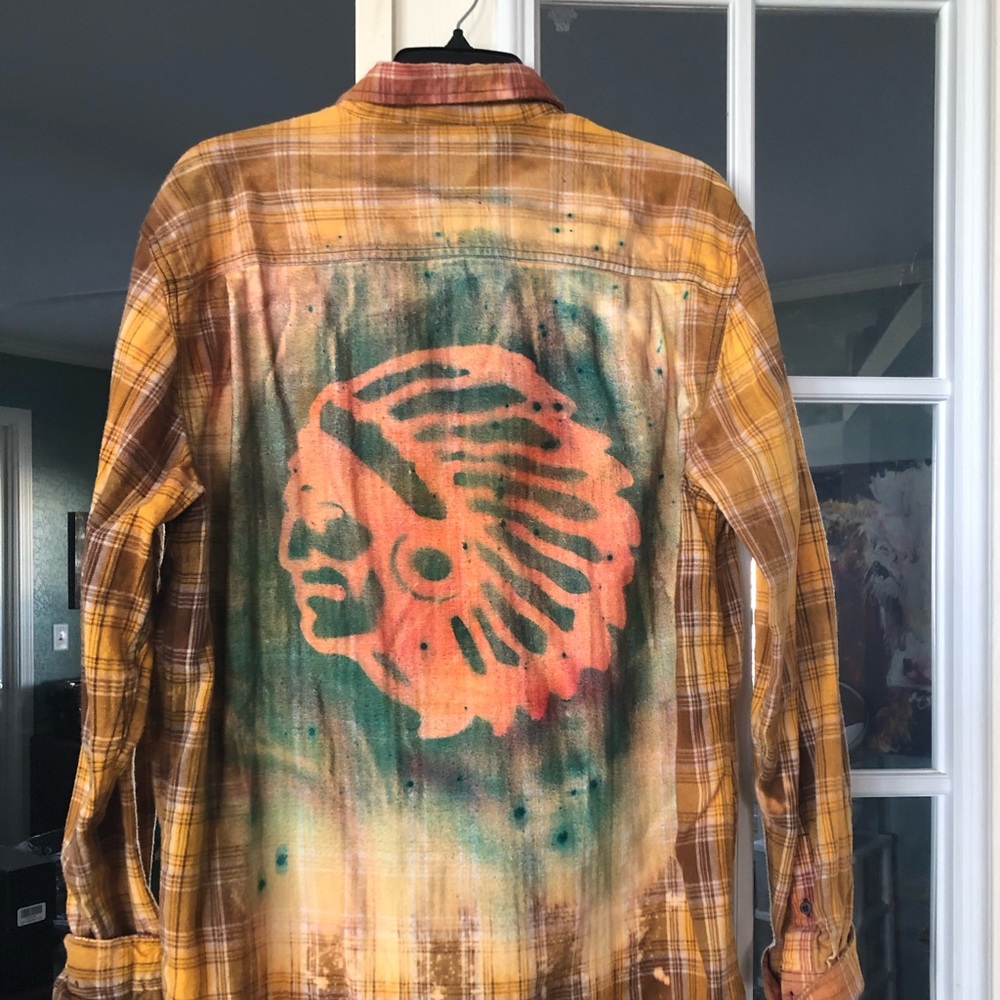 Flannel button up shirt with Indian Headdress on the back.